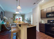 Thumbnail 15 of 30 - Fully Equipped Kitchen at The Heritage at Arlington Apartment Homes, Greenville, NC, 27834