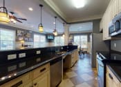 Thumbnail 10 of 30 - Community Kitchen at The Heritage at Arlington Apartment Homes, Greenville, NC