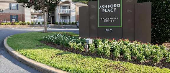 a sign at the entrance of ashwood place apartments