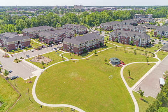 Community Park with Playground, Dog Park, and Walking Trail t The Heritage at Arlington Apartment Homes, Greenville, NC, 27834