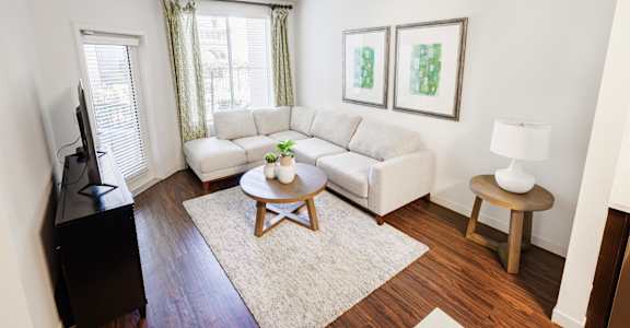 a living room with a couch and a table