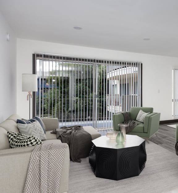 a living room filled with furniture and a ceiling fan