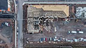 A construction site with a large building under construction.