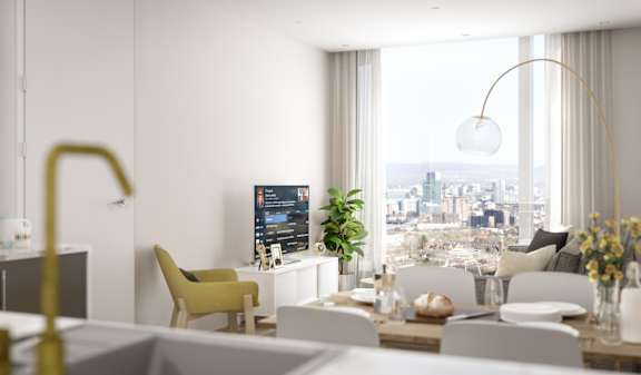 A modern living room with a large window overlooking the city.