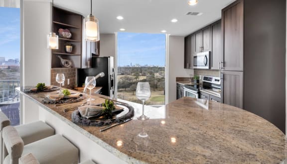Elegant kitchen with granite countertops and modern amenities in Houston, TX