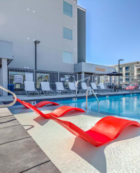 The Boulevard Outdoor Pool with Lounge Chairs