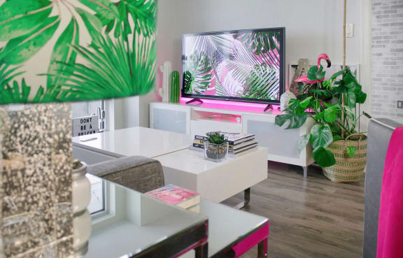 a living room with a table and a television
