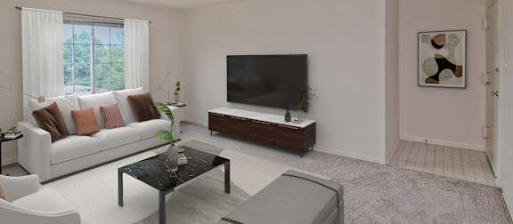 A living room with a white sofa, green chairs, and a television. at Dulles Glen Apartments, Herndon, VA, 20170