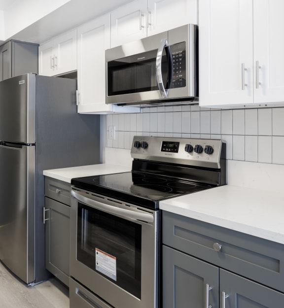 an empty room with a washer and dryer in it