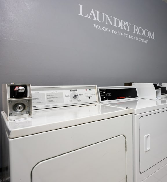 a laundry room with a washer and dryer