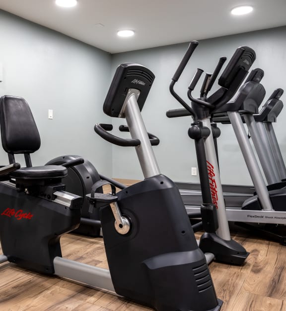 the gym at the enclave at woodbridge apartments in sugar land, tx