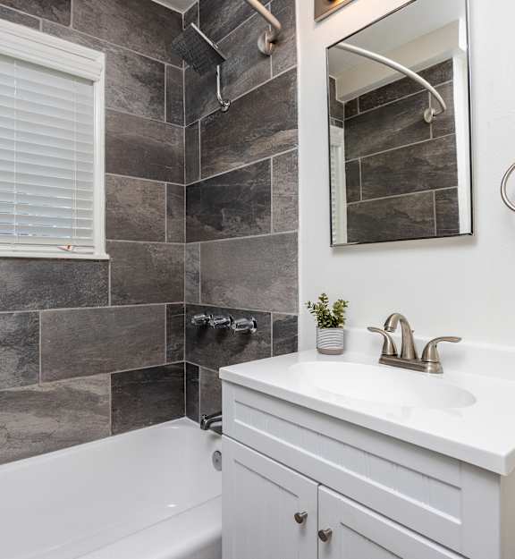a laundry room with two washers and two washing machines