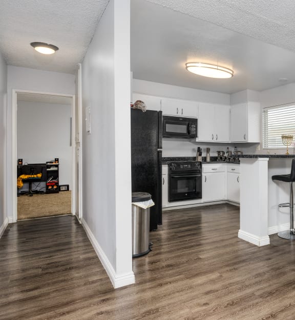 a kitchen and dining area in a 555 waverly unit