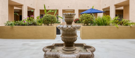 a fountain in the courtyard of a hotel