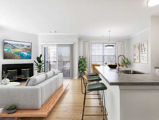 A modern living room with a grey sofa and a fireplace. at The Mercer at Lawrence Station, Lawrence Township, 08648