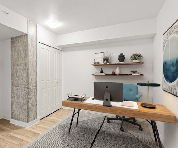 A room with a desk and a chair.
