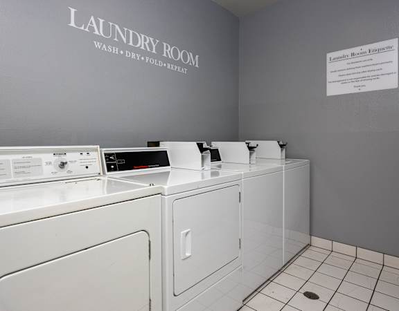 a laundry room with a washer and dryer