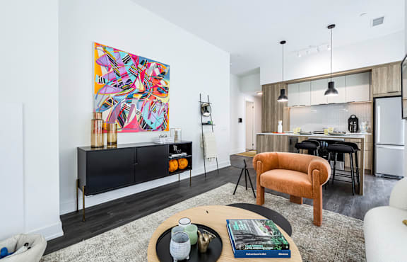 a living room with a couch and pictures on the wall