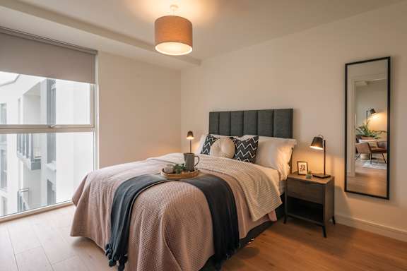 A bedroom with a large bed and a large window at Cherrywood Apartments, D18 VY3V, DUBLIN 18
