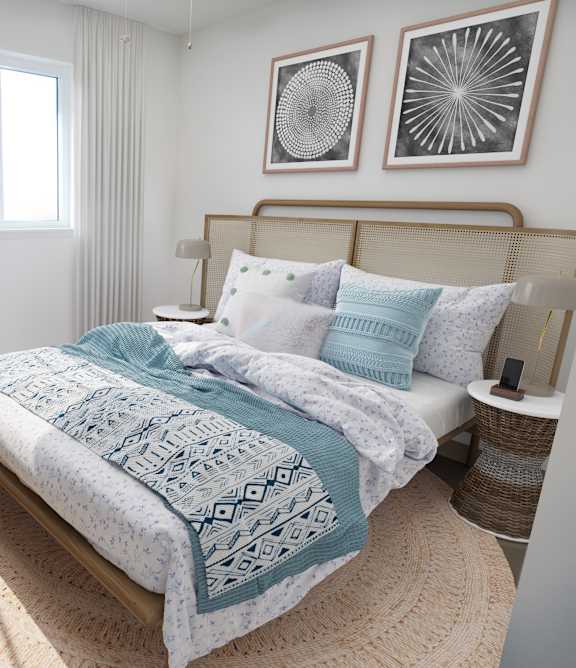 a bedroom with a bed and a dresser and a window