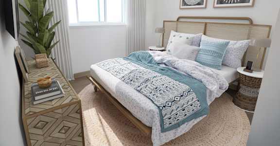 a bedroom with a bed and a dresser and a window
