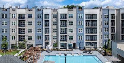 A large apartment complex with a pool in the courtyard at The Collective Upper Westside Apartments, Atlanta, GA, 30318