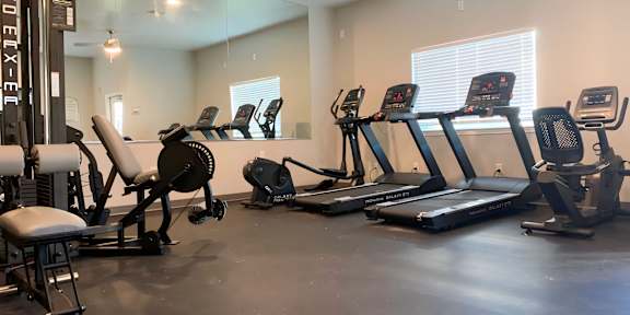 the gym at the monarch luxury apartments