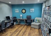 Thumbnail 11 of 19 - Business center with books, computers and printer