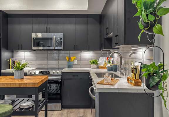 Kitchen with cabinets at AMP 30 Apartments, San Diego