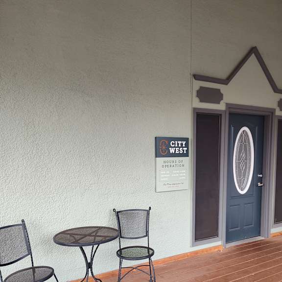 a pair of sunglasses on a wall next to a window