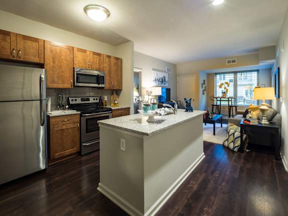 a living room and dining room with a couch and a table at STRATA West, Allentown, Pennsylvania