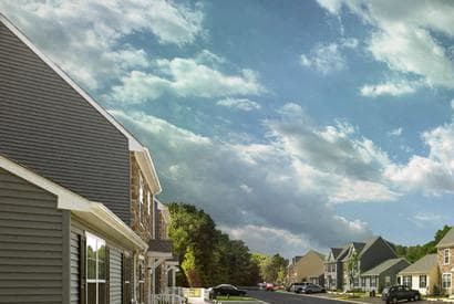 a row of houses on the side of a street