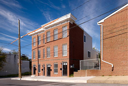 a brick building on the corner of a street