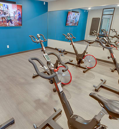 a spin class room in a gym with exercise bikes at Gabella at Parkside, Minnesota