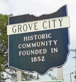 a street sign that reads grove city historic community founded in 1852