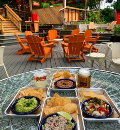 a tray of food on a table on a patio