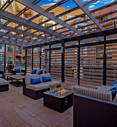 a patio with couches and a coffee table