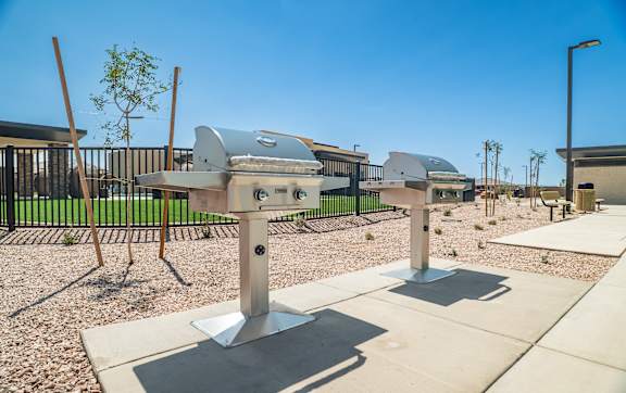 A playground with a slide and a picnic table.