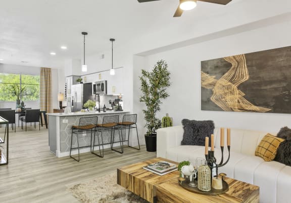 A bright bedroom with modern decor and sign features at Zone Westgate, apartments in Glendale, AZ.