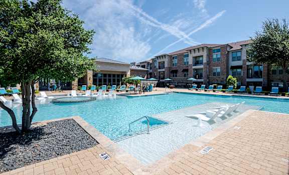 our apartments have a large swimming pool with lounge chairs