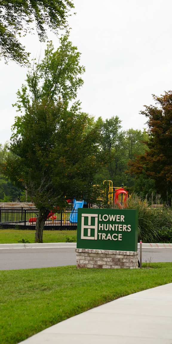 A green sign with the words "Lower Trace" on it.