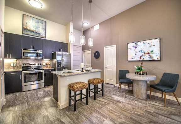 a living room with a couch and a table at South Side Flats in Dallas, 752