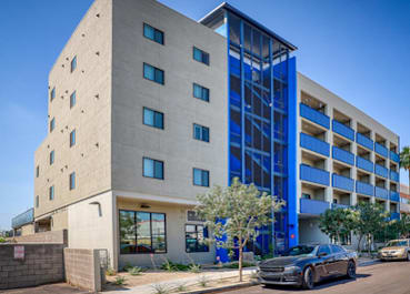 A modern building with a blue and white facade.