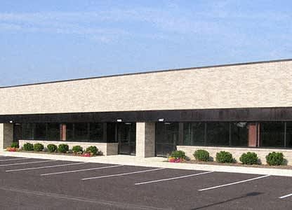 an empty parking lot in front of a building