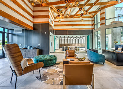 A modern living room with a striped ceiling and wooden furniture.