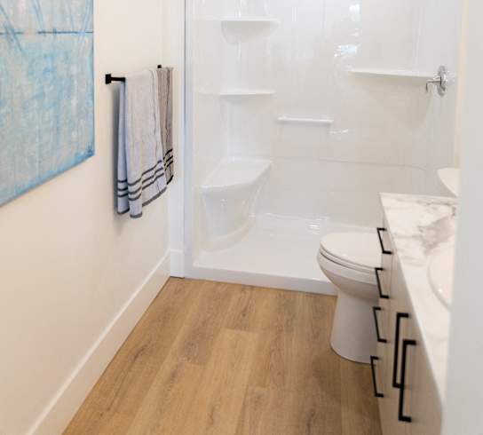 a small bathroom with a shower and a toilet