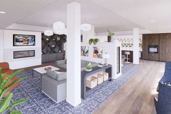 A modern living room with a grey sofa and a fireplace.