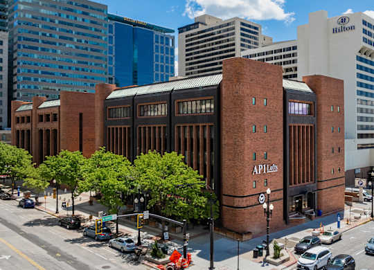A large brick building with the words API labs on the side.