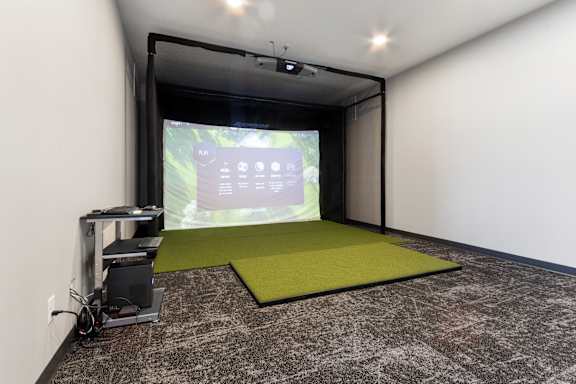 A projection room with a screen and a projector.