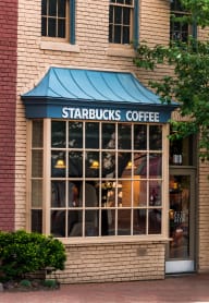 A Starbucks Coffee shop is located in a brick building at Seminary Towers, Alexandria, Virginia